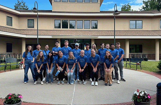 Selective 2024 Ignite interns in matching blue T-Shirts at their Volunteer Day.